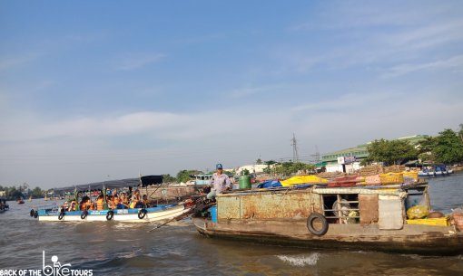 tourist on a tour of the floating markets in Can Tho